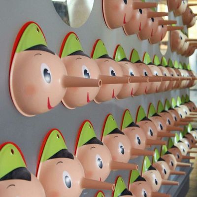 A fact checker hangs up his Pinocchios